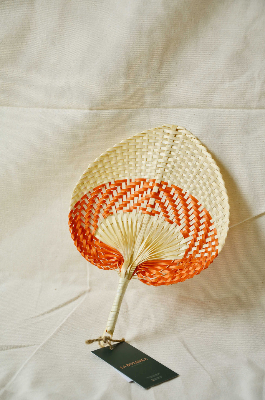 La Botanica Palm Leaf Orange Hand Fan